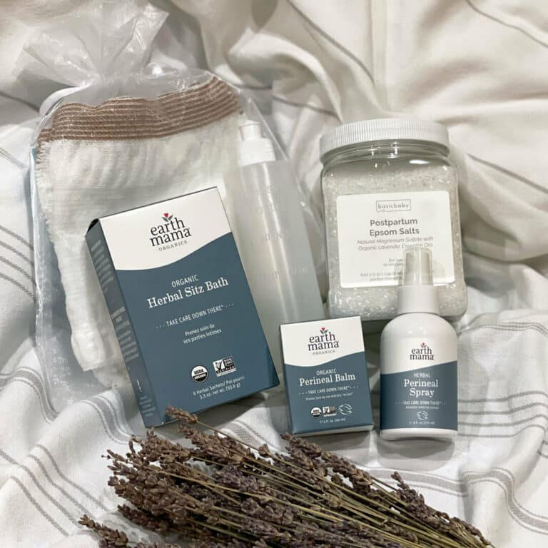 perineal balm, bath sitz, bottom spray, and wipes from Earth Mama that's used for postpartum care displayed with some lavender