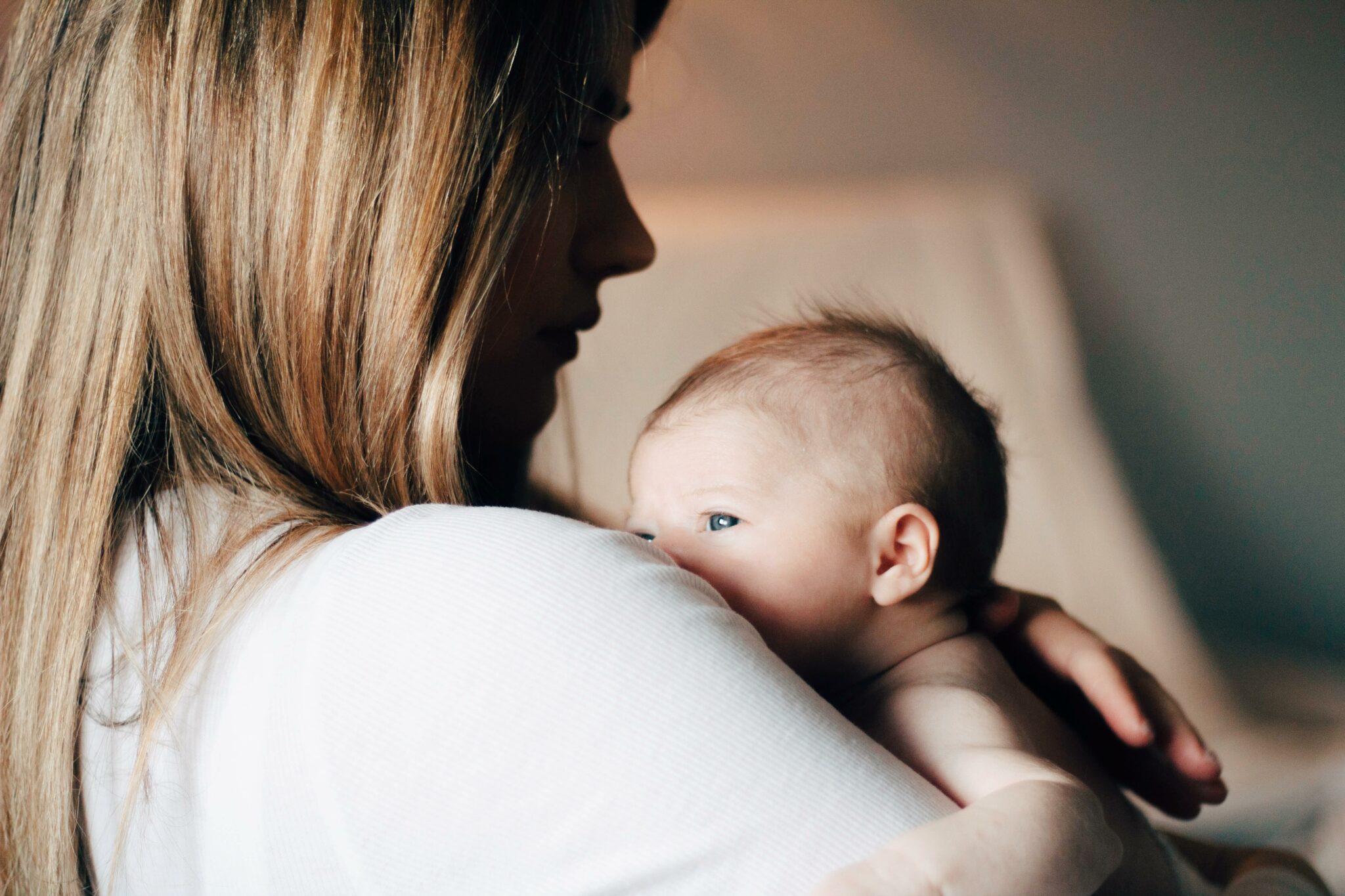 a newborn baby on her mother